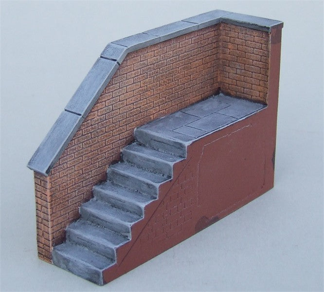 Brick steps with brick bannister on one side